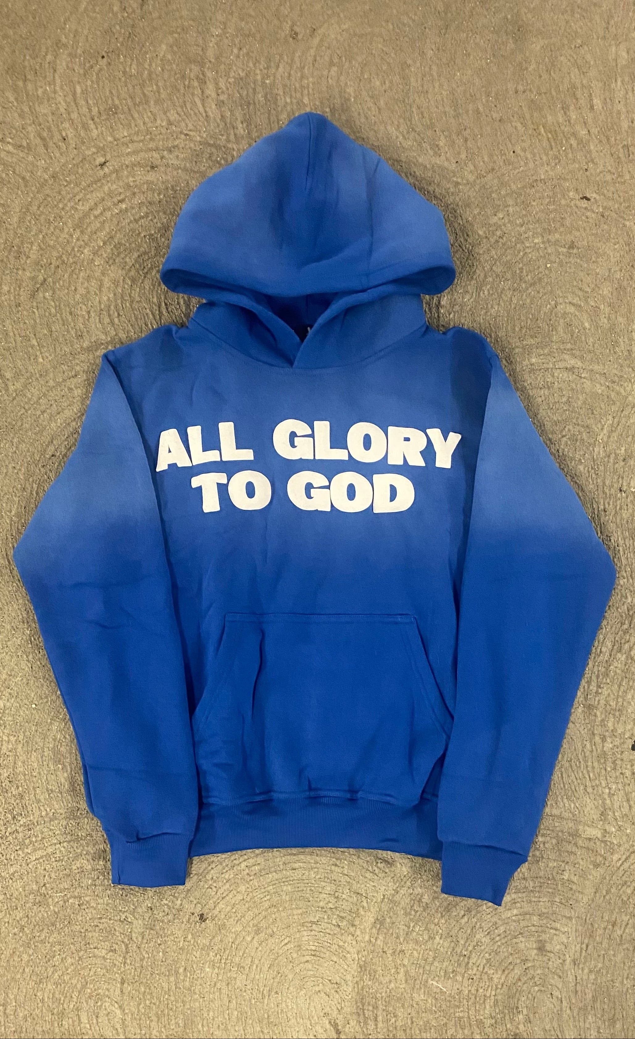 Blue hoodie with 'All Glory To God' 